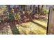 Lush backyard with a view of trees and greenery and a glimpse of the wooden fence at 709 Pine Tree Trl # 10A, Atlanta, GA 30349