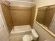 Tiled bathroom featuring a shower and tub combination, and a toilet at 709 Pine Tree Trl # 10A, Atlanta, GA 30349