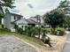 Two-story home featuring a garage, mature trees and landscaping at 709 Pine Tree Trl # 10A, Atlanta, GA 30349