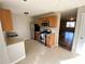 A well-lit kitchen area showcasing stainless steel appliances and wood-look cabinetry at 709 Pine Tree Trl # 10A, Atlanta, GA 30349