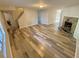 Spacious living room featuring wood-look flooring and a decorative stone fireplace at 709 Pine Tree Trl # 10A, Atlanta, GA 30349