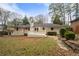 Exterior shot showcasing the house's deck and landscaped backyard at 2151 Zelda Ne Dr, Atlanta, GA 30345
