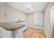 The finished basement features a wet bar with granite countertop and white cabinetry at 2151 Zelda Ne Dr, Atlanta, GA 30345