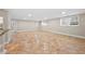 The finished basement area showcases tiled flooring and recessed lighting at 2151 Zelda Ne Dr, Atlanta, GA 30345