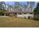 Charming brick ranch-style home with a covered carport and lush, mature landscaping at 2151 Zelda Ne Dr, Atlanta, GA 30345