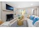 Comfortable living room with a whitewashed brick fireplace and ample seating space at 2151 Zelda Ne Dr, Atlanta, GA 30345
