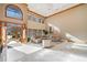 Open-concept living room with marble floors, wood trim, and soaring ceilings open to the entryway and the skylights above at 2597 Cosmos Ne Ct, Atlanta, GA 30345