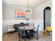 Bright dining room featuring modern chandelier and stylish accents at 3157 Oakdale Rd, Hapeville, GA 30354