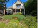 Charming two-story home with a welcoming front porch and well-maintained landscaping at 3157 Oakdale Rd, Hapeville, GA 30354