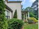 Well-maintained home exterior with manicured landscaping and inviting covered porch at 3157 Oakdale Rd, Hapeville, GA 30354