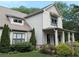 Charming two-story home boasts manicured landscaping and architectural details at 3157 Oakdale Rd, Hapeville, GA 30354