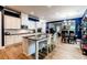 Bright kitchen featuring white cabinets, granite countertops, stainless steel appliances, and an island with seating at 3157 Oakdale Rd, Hapeville, GA 30354