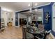Open-concept living room featuring wood floors, elegant lighting, and a cozy dining area at 3157 Oakdale Rd, Hapeville, GA 30354