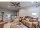 Upstairs living room with hardwood floors, ceiling fan, and staircase view at 3157 Oakdale Rd, Hapeville, GA 30354