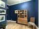 Stylish living room with beautiful hardwood floors and elegant blue walls at 3157 Oakdale Rd, Hapeville, GA 30354