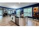 Open-concept living space with a kitchen island, fireplace, and abundant natural light at 3157 Oakdale Rd, Hapeville, GA 30354