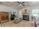 Inviting living room with a fireplace, wood floors, and stylish furnishings at 3157 Oakdale Rd, Hapeville, GA 30354