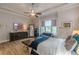 Serene main bedroom features hardwood floors, a ceiling fan, and a large window with window treatments at 3157 Oakdale Rd, Hapeville, GA 30354