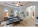 Primary suite featuring tray ceilings, hardwood floors, a ceiling fan and walk-in closet at 3157 Oakdale Rd, Hapeville, GA 30354