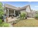 Charming backyard patio with lush landscaping and a covered seating area perfect for entertaining at 3157 Oakdale Rd, Hapeville, GA 30354