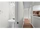 Hallway bathroom includes stylish pedestal sink, modern fixtures, and attractive design at 4102 Dinmont Chase, Atlanta, GA 30349