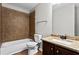 Bathroom features brown tiled shower, granite countertop and dark wood cabinets at 4102 Dinmont Chase, Atlanta, GA 30349