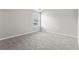 Bright bedroom features neutral carpet and large window providing natural light at 4102 Dinmont Chase, Atlanta, GA 30349