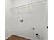 Walk-in closet featuring wire shelving, hardwood floors, and utility connections at 4102 Dinmont Chase, Atlanta, GA 30349
