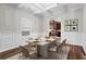 Refined dining room featuring wainscotting, coffered ceiling, and stylish decor creating an inviting space at 4102 Dinmont Chase, Atlanta, GA 30349