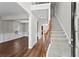 Bright foyer with hardwood floors, staircase, and an open view to the living and dining areas at 4102 Dinmont Chase, Atlanta, GA 30349