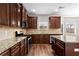 This beautiful kitchen features granite countertops, stainless steel appliances, and dark wood cabinets at 4102 Dinmont Chase, Atlanta, GA 30349