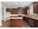 Stylish kitchen with granite countertops, island, and dark cabinetry at 4102 Dinmont Chase, Atlanta, GA 30349