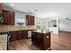 Kitchen with granite countertops, island and sightlines to living area at 4102 Dinmont Chase, Atlanta, GA 30349