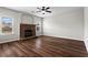 Spacious living room with fireplace and dark hardwood flooring at 4102 Dinmont Chase, Atlanta, GA 30349