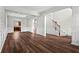 Inviting open-concept living space with hardwood floors, stylish trim, and seamless flow to other rooms at 4102 Dinmont Chase, Atlanta, GA 30349