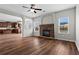 Open-concept living area with fireplace and dark hardwood floors at 4102 Dinmont Chase, Atlanta, GA 30349