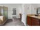 Main bathroom with double sink vanity, glass shower and tile surround at 4102 Dinmont Chase, Atlanta, GA 30349