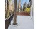 Spacious back deck with black railing and unique tree feature at 4830 Rebel Nw Trl, Sandy Springs, GA 30327