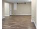 Large, unfinished basement with lighting fixture and door at 4830 Rebel Nw Trl, Sandy Springs, GA 30327
