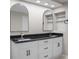 Renovated bathroom with dual sinks, white cabinets, and stylish black hardware at 4830 Rebel Nw Trl, Sandy Springs, GA 30327