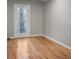 Bedroom featuring hardwood floors, a window, and fresh paint at 4830 Rebel Nw Trl, Sandy Springs, GA 30327
