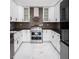 Well-lit kitchen featuring modern cabinets, stainless steel appliances, and sleek countertops at 4830 Rebel Nw Trl, Sandy Springs, GA 30327