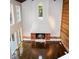 Bright and airy living room with floor to ceiling fireplace, wood floors and modern accents at 4830 Rebel Nw Trl, Sandy Springs, GA 30327