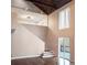Bright living room with hardwood floors, stairs, neutral paint, and natural light from tall windows at 4830 Rebel Nw Trl, Sandy Springs, GA 30327