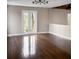 Living space with hardwood flooring, white trim and natural light with deck access at 4830 Rebel Nw Trl, Sandy Springs, GA 30327