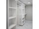 Spacious walk-in closet features custom shelving and ample storage space at 4830 Rebel Nw Trl, Sandy Springs, GA 30327