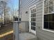 Exterior door and windows of the house, complemented by gray siding and well-maintained landscaping at 3713 Cameron Hills Pl, Ellenwood, GA 30294