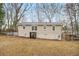 Rear view of the home featuring a spacious backyard and a fenced area at 1438 Joy Ln, Decatur, GA 30032