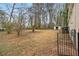 Expansive backyard with mature trees and a storage shed at 1438 Joy Ln, Decatur, GA 30032