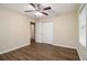 Cozy bedroom featuring wood floors, a ceiling fan, and a bright window at 1438 Joy Ln, Decatur, GA 30032